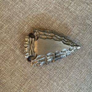 Silver arrowhead belt buckle